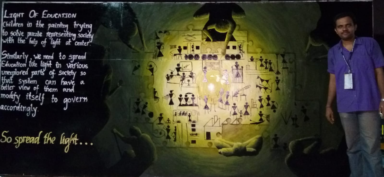 Kalpesh RC beside the completed Light of Education mural in Mumbai